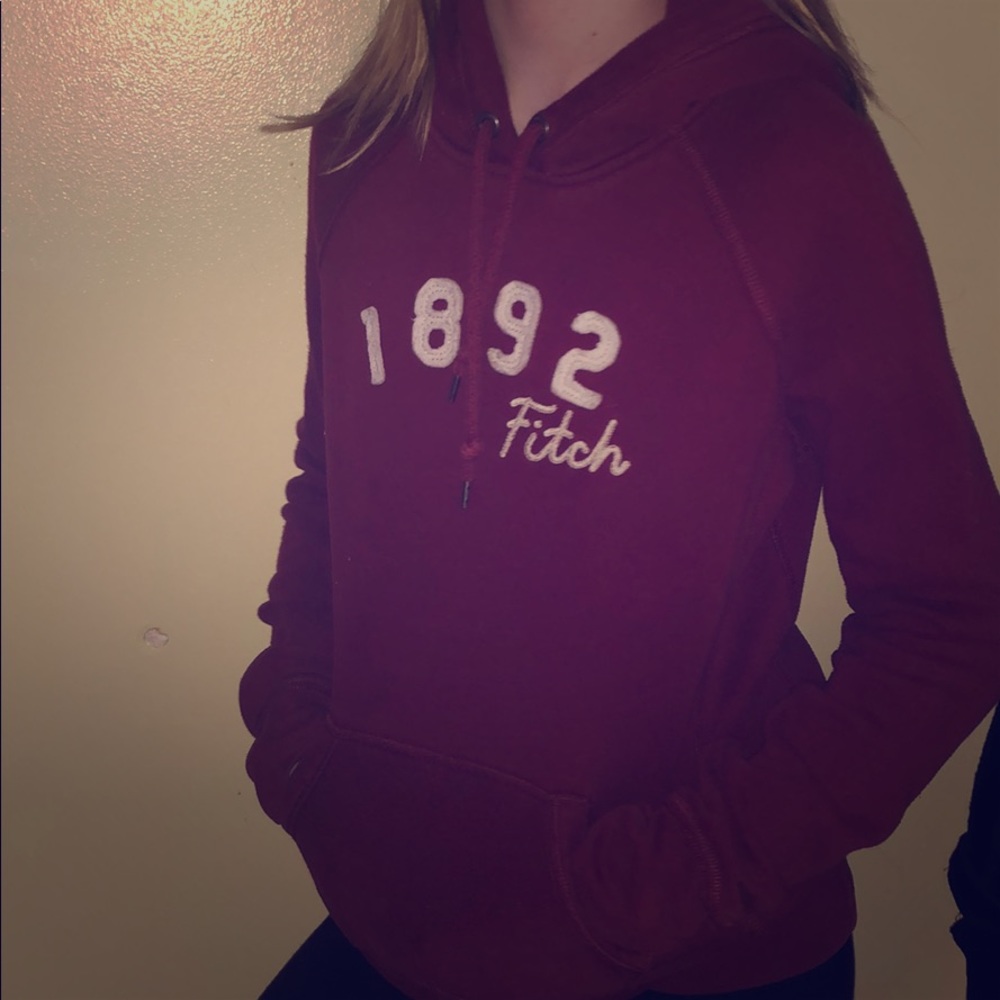 Red/Maroonish colored Sweatshirt.